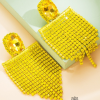 Aretes banderolas de borlas amarillo